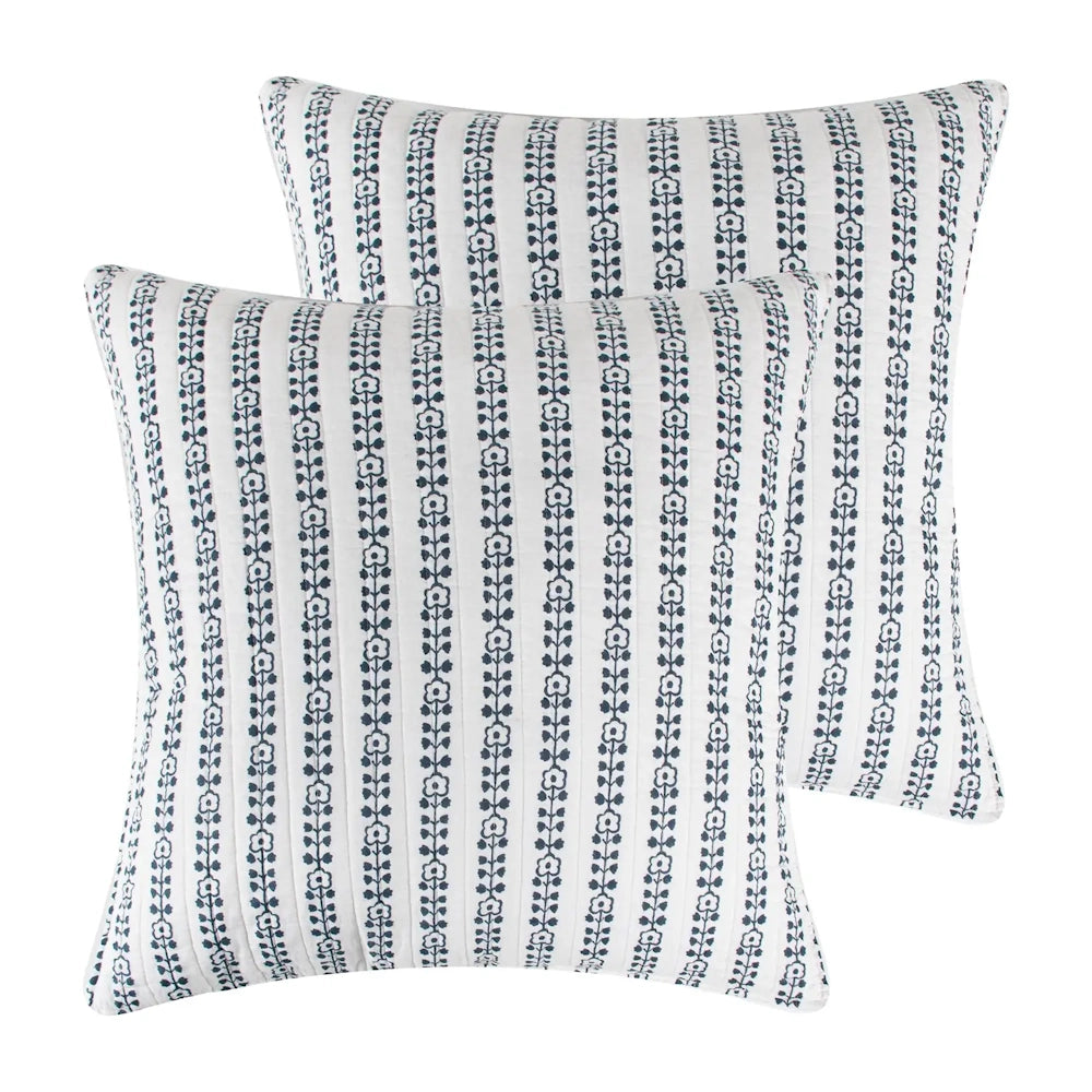 Pair of white square pillow shams with navy vertical floral stripe patterns on a white background.