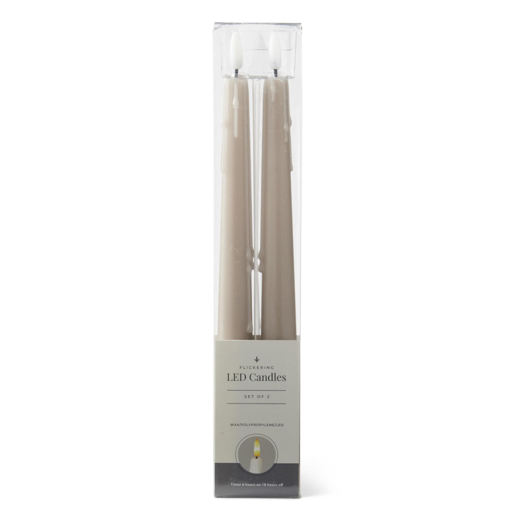 A pack of two taupe, faux-drip LED taper candles in clear packaging.