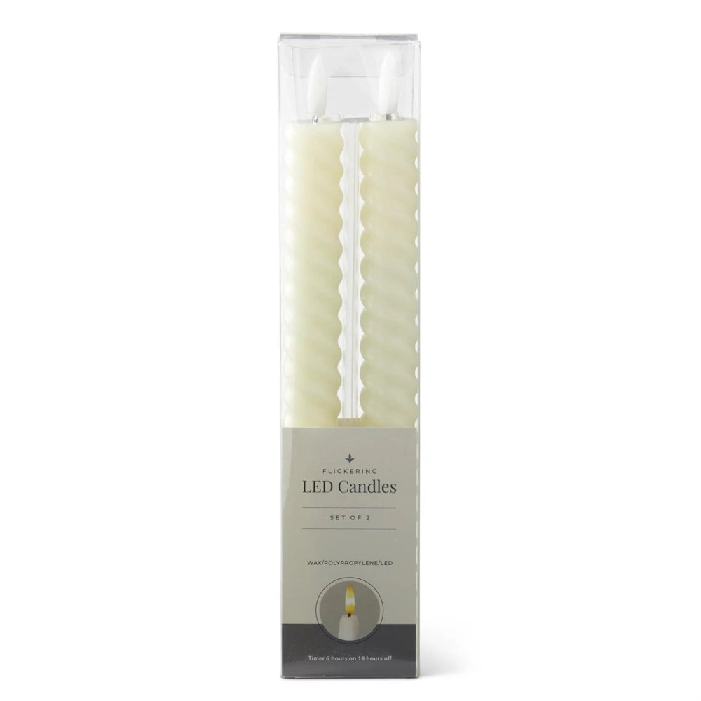 A boxed set of two ivory, spiral-textured LED taper candles with plastic flame tips.