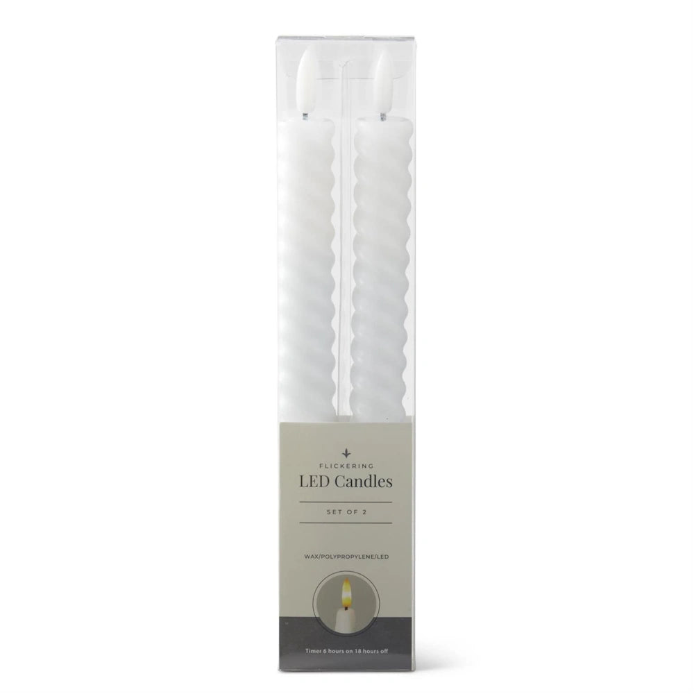 A set of two white, spiral-designed flickering LED taper candles in clear packaging.