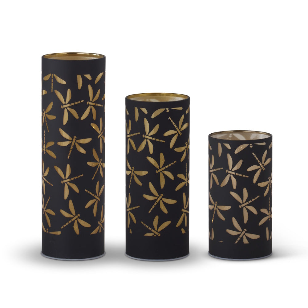 Set of 3 black and gold laser-engraved dragonfly LED cylinder lanterns in varying heights for home decor.