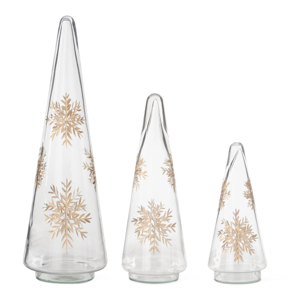 Set of three clear glass cone trees decorated with etched gold snowflake patterns in varying heights.