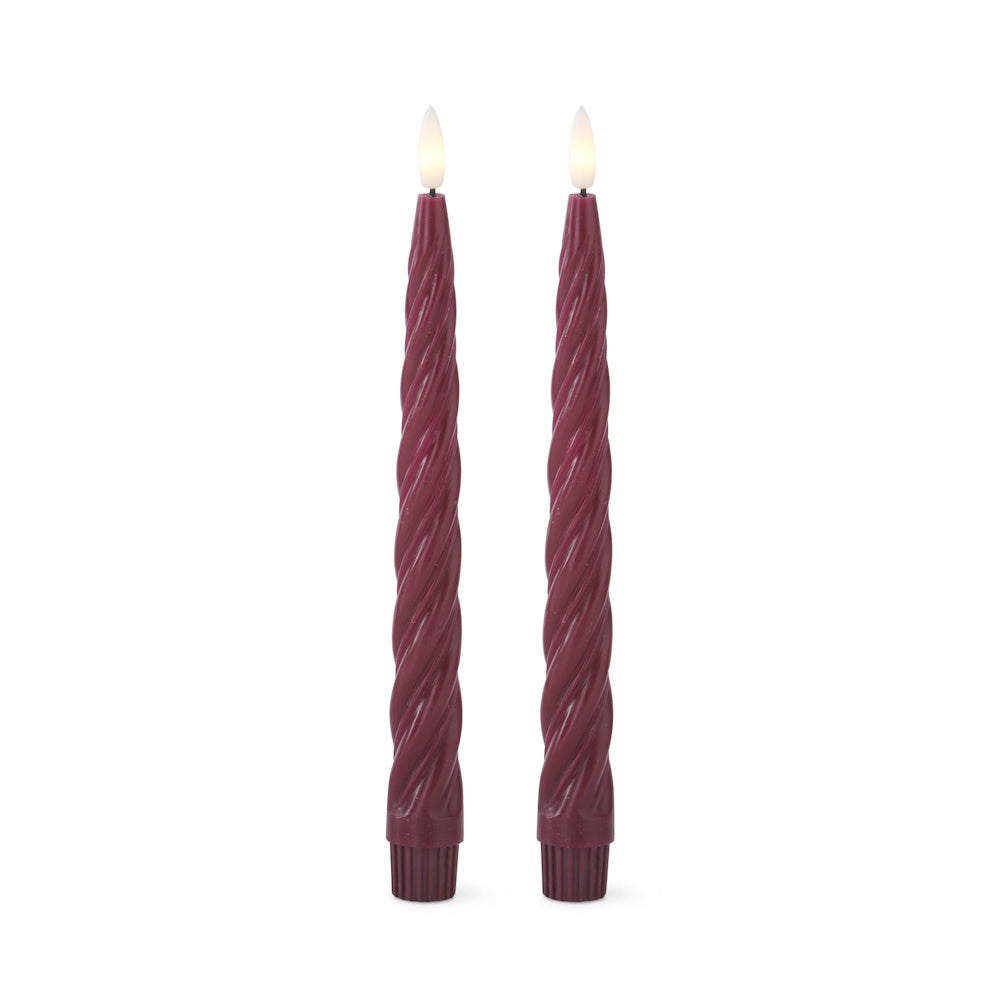 Two burgundy spiral LED taper candles with glowing faux flames against a white background.