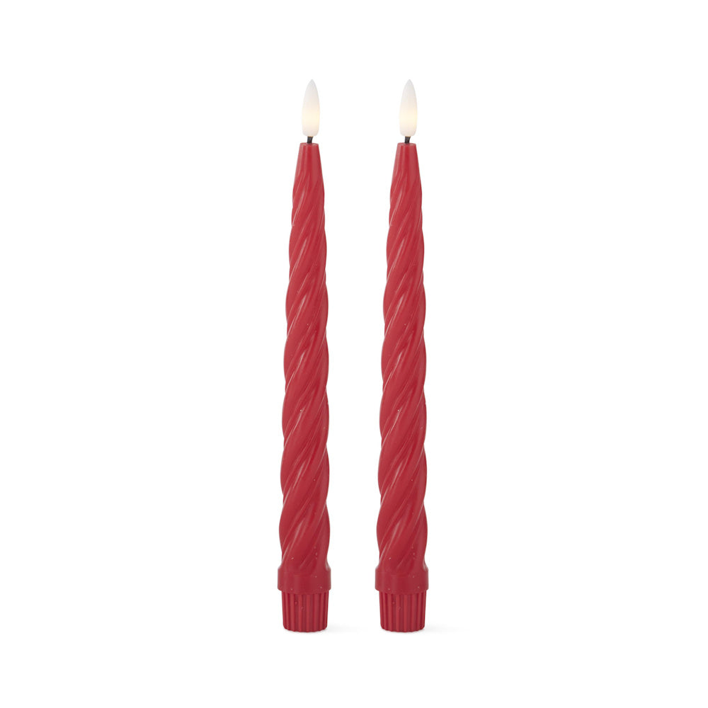 Two red, spiral-textured LED taper candles with glowing, flame-shaped tips standing on a white background.