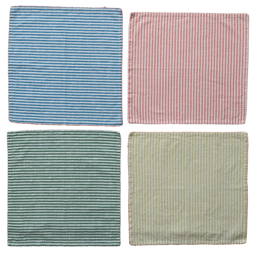 Set of four striped cotton cloth napkins in blue, coral, green, and yellow with scalloped edges.