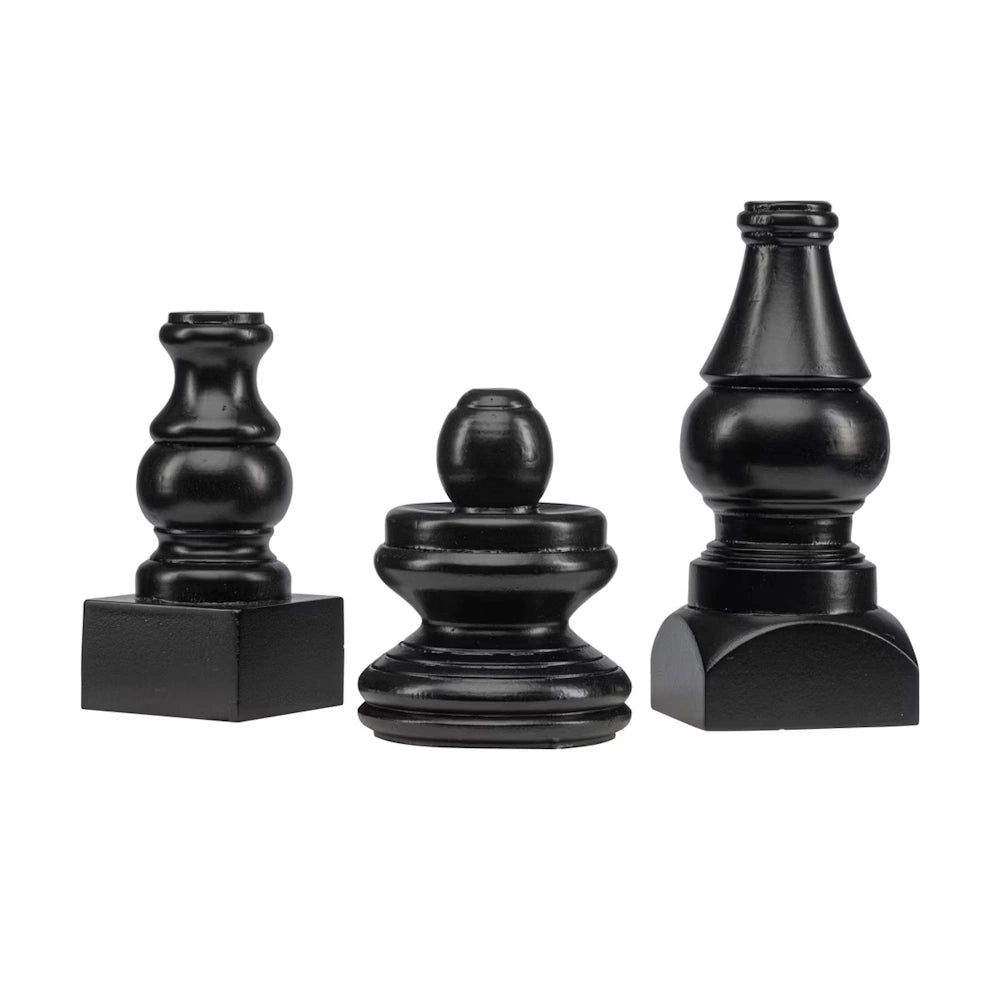 Front view of three short black wooden display poles featuring distinct turned finial styles.