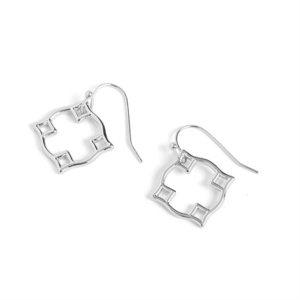 Silver open geometric quatrefoil dangle earrings with fishhook wires on a white background.
