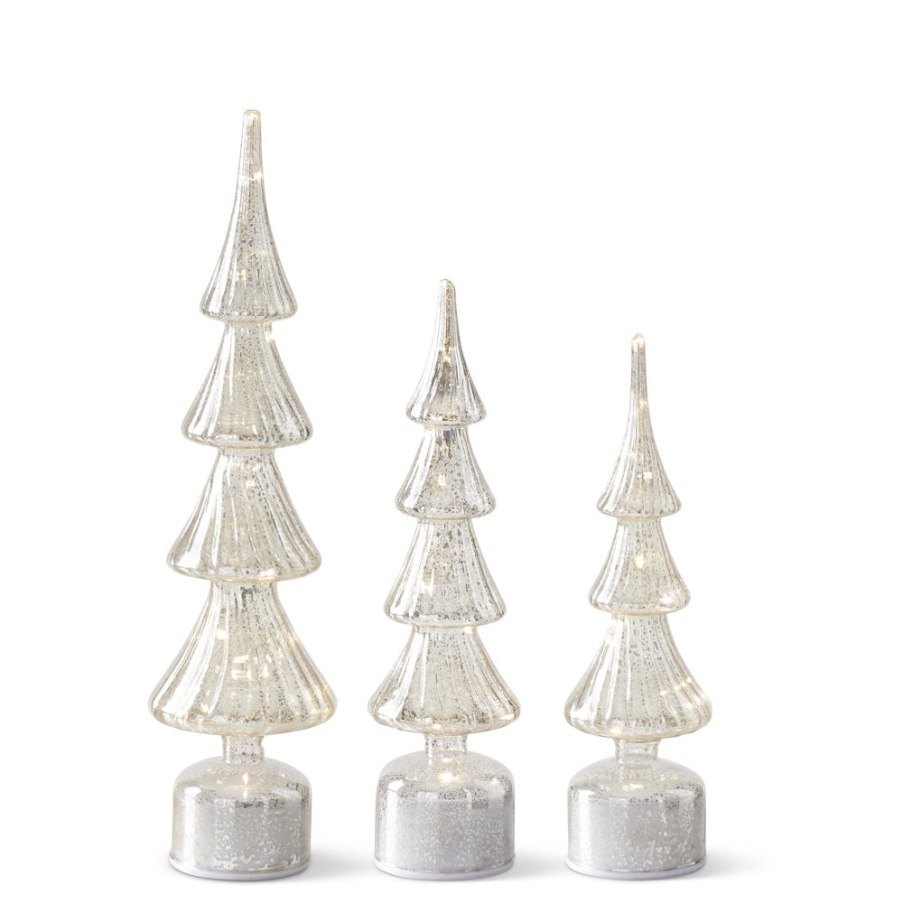 Set of three silver mercury glass LED Christmas trees in varying sizes with warm internal lights.
