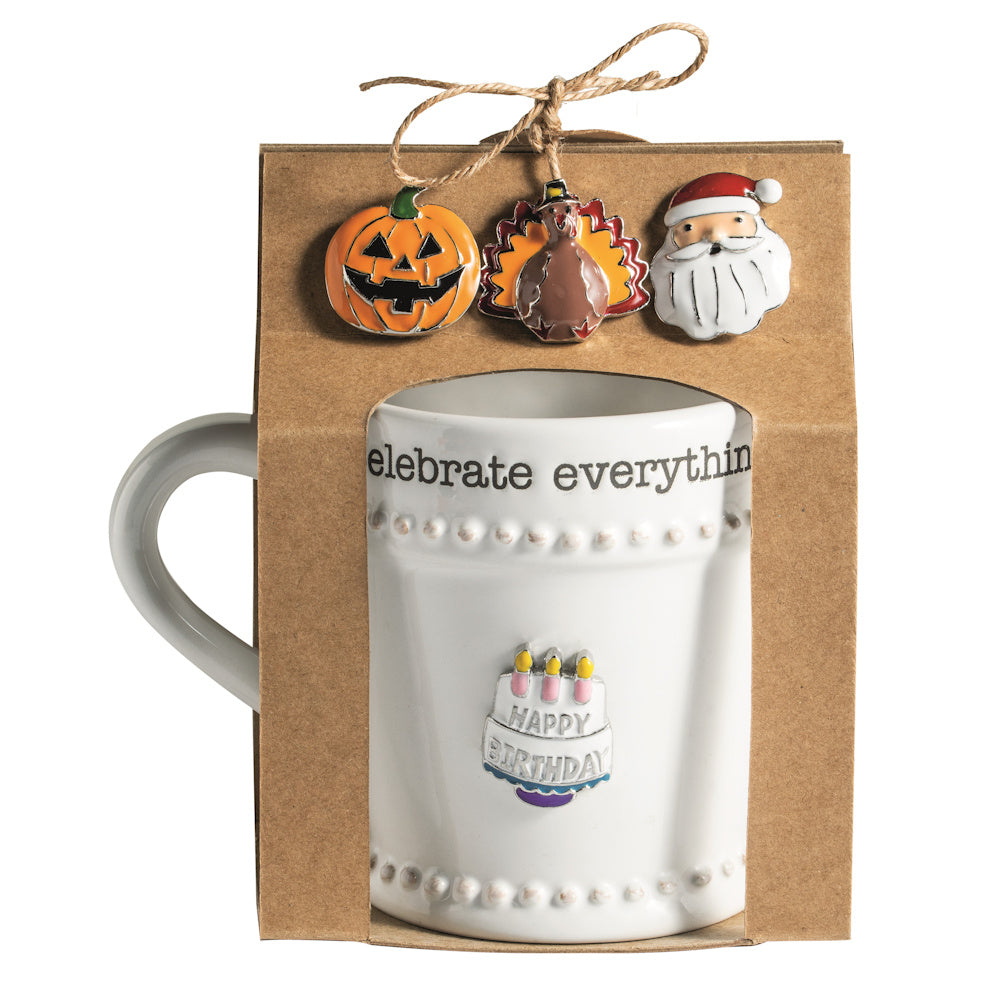 Celebrate Everything ceramic mug set with interchangeable holiday magnetic charms: pumpkin, turkey, Santa, and birthday cake.