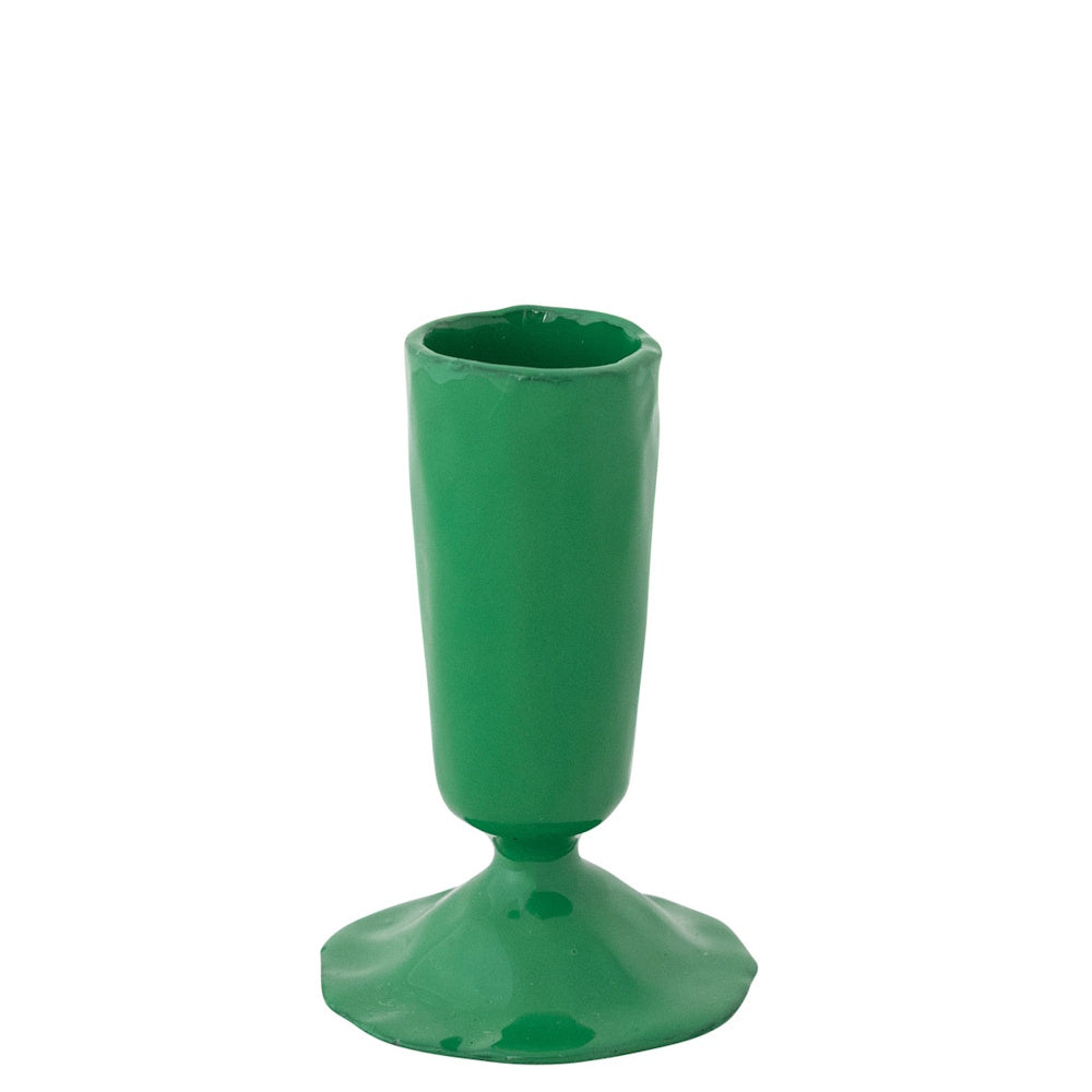 Small green enameled cast iron taper candle holder on a plain white background.
