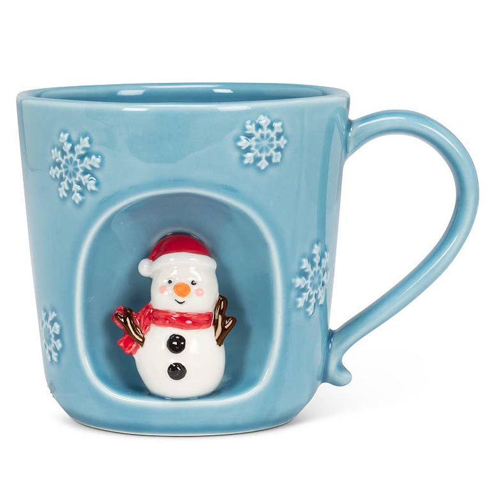 Light blue snowflake ceramic mug with a recessed alcove featuring a 3D snowman figure.