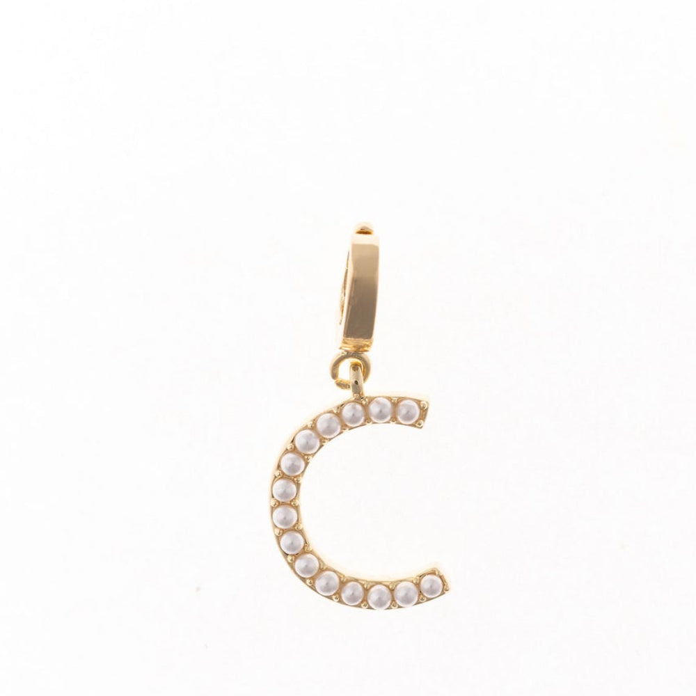 Gold letter 'C' charm studded with small white faux pearls on a plain white background.