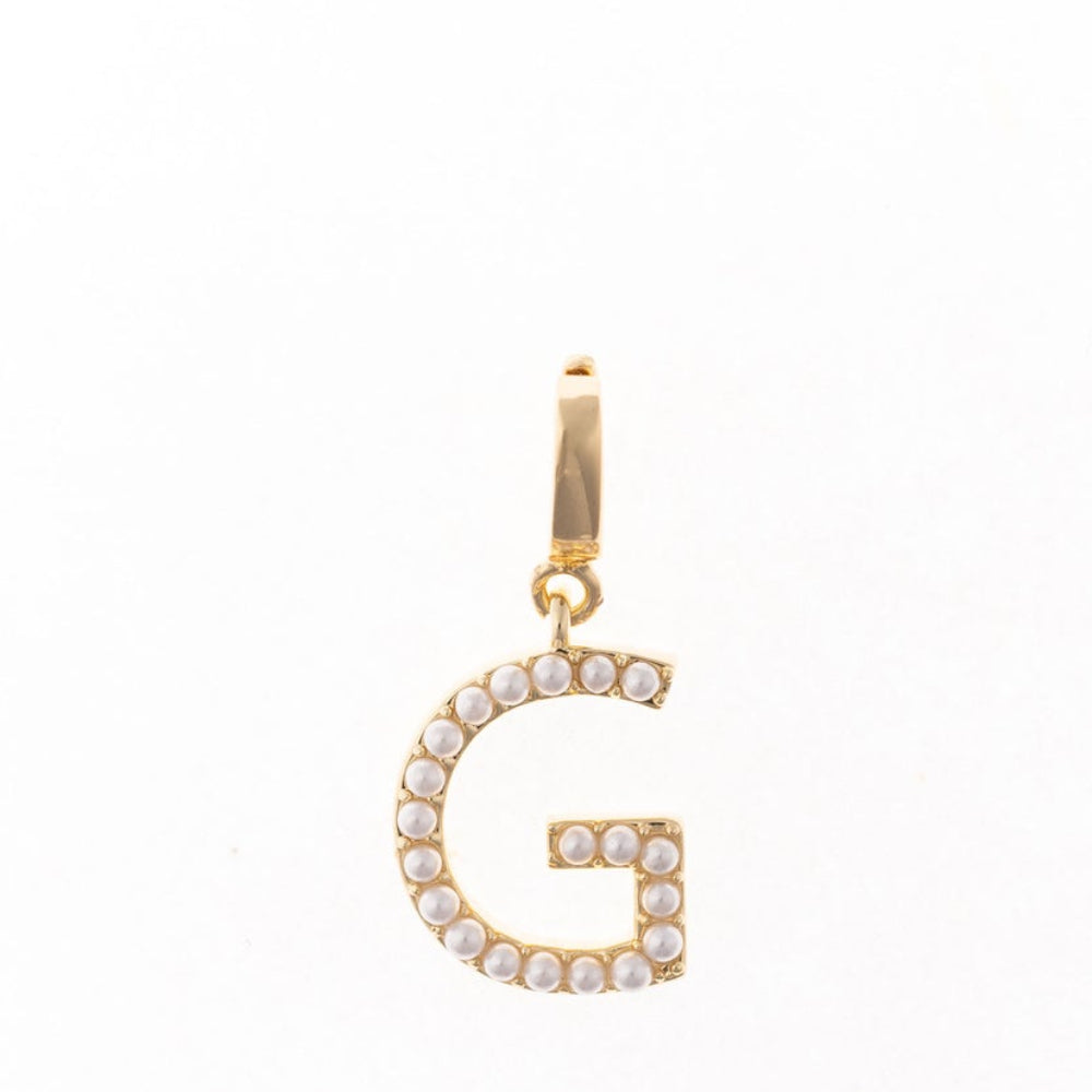 Gold letter 'G' charm studded with small white faux pearls on a plain white background.
