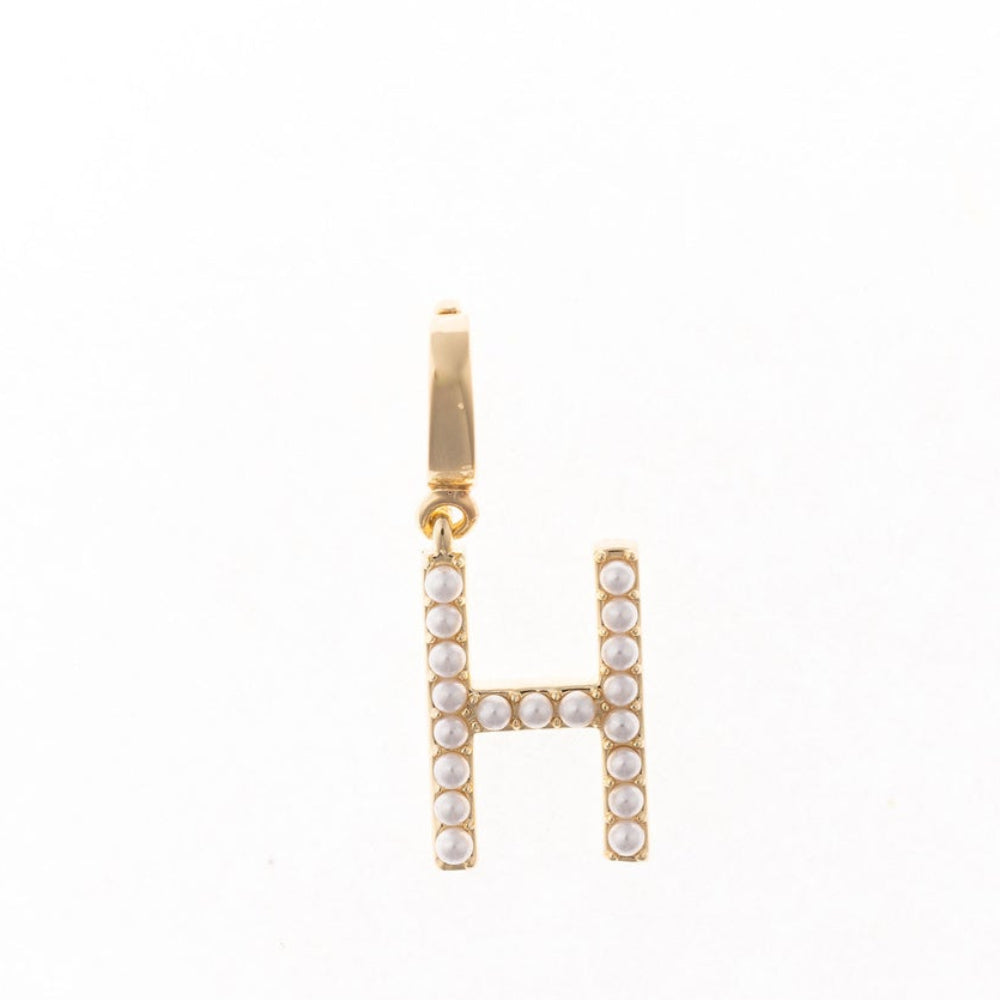 Gold letter 'H' charm studded with small white faux pearls on a plain white background.