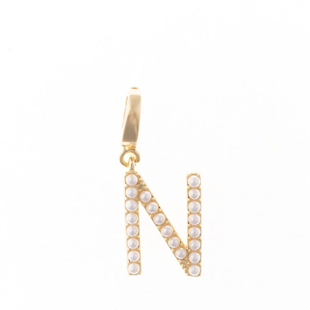 Gold letter 'N' charm studded with small white faux pearls on a plain white background.