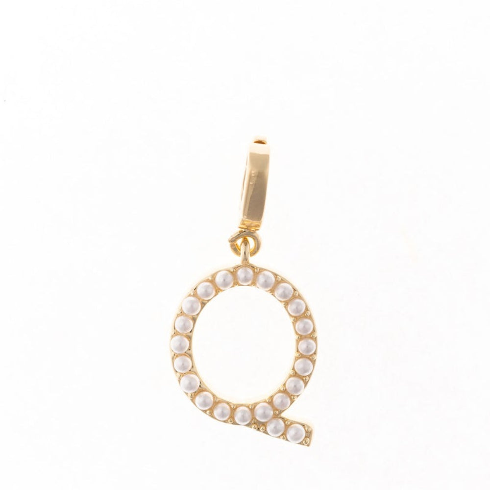 Gold letter 'Q' charm studded with small white faux pearls on a plain white background.