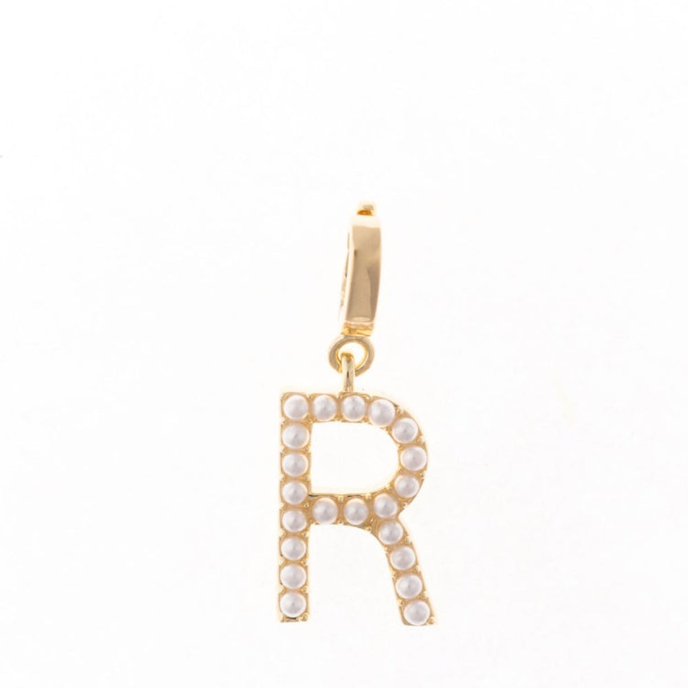 Gold letter 'R' charm studded with small white faux pearls on a plain white background.