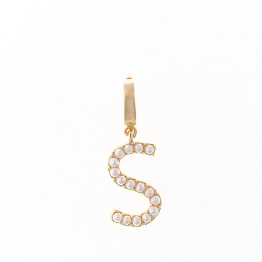Gold letter 'S' charm studded with small white faux pearls on a plain white background.