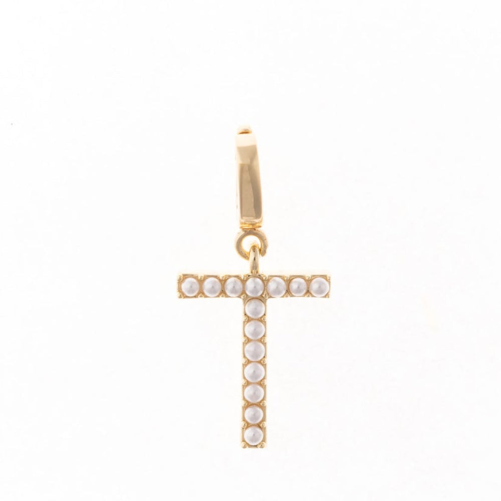 Gold letter 'T' charm studded with small white faux pearls on a plain white background.