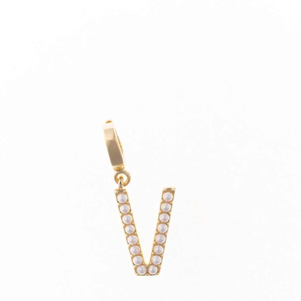 Gold letter 'V' charm studded with small white faux pearls on a plain white background.
