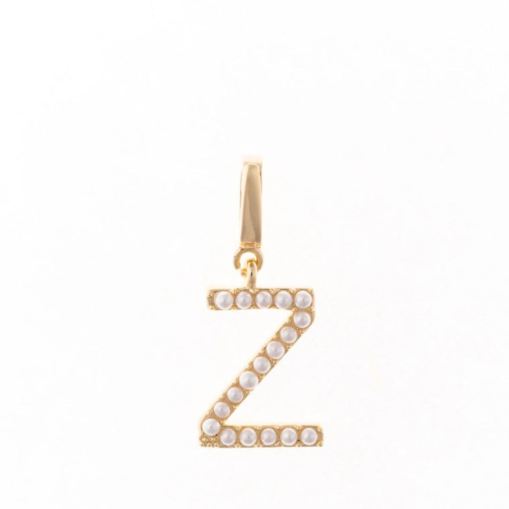 Gold letter 'Z' charm studded with small white faux pearls on a plain white background.
