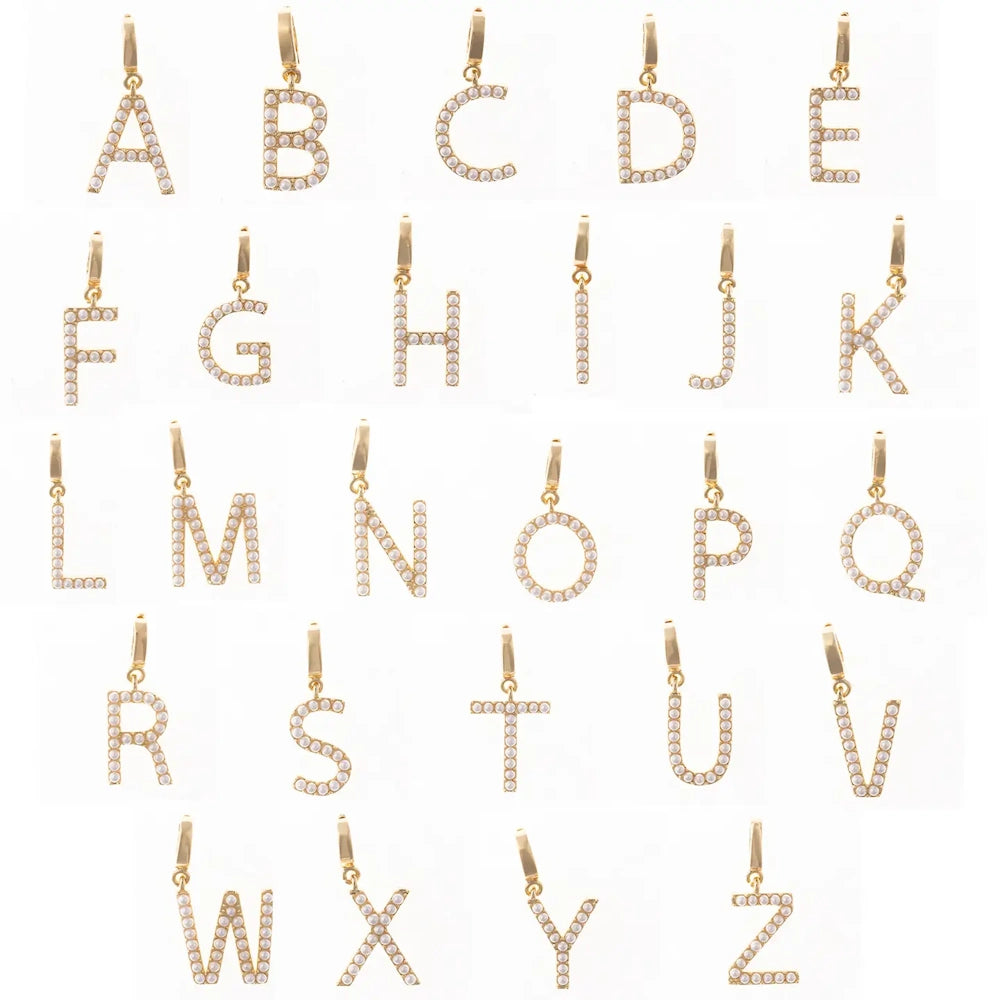 Gold alphabet letter charms studded with small faux pearls, A through Z, on a white background.
