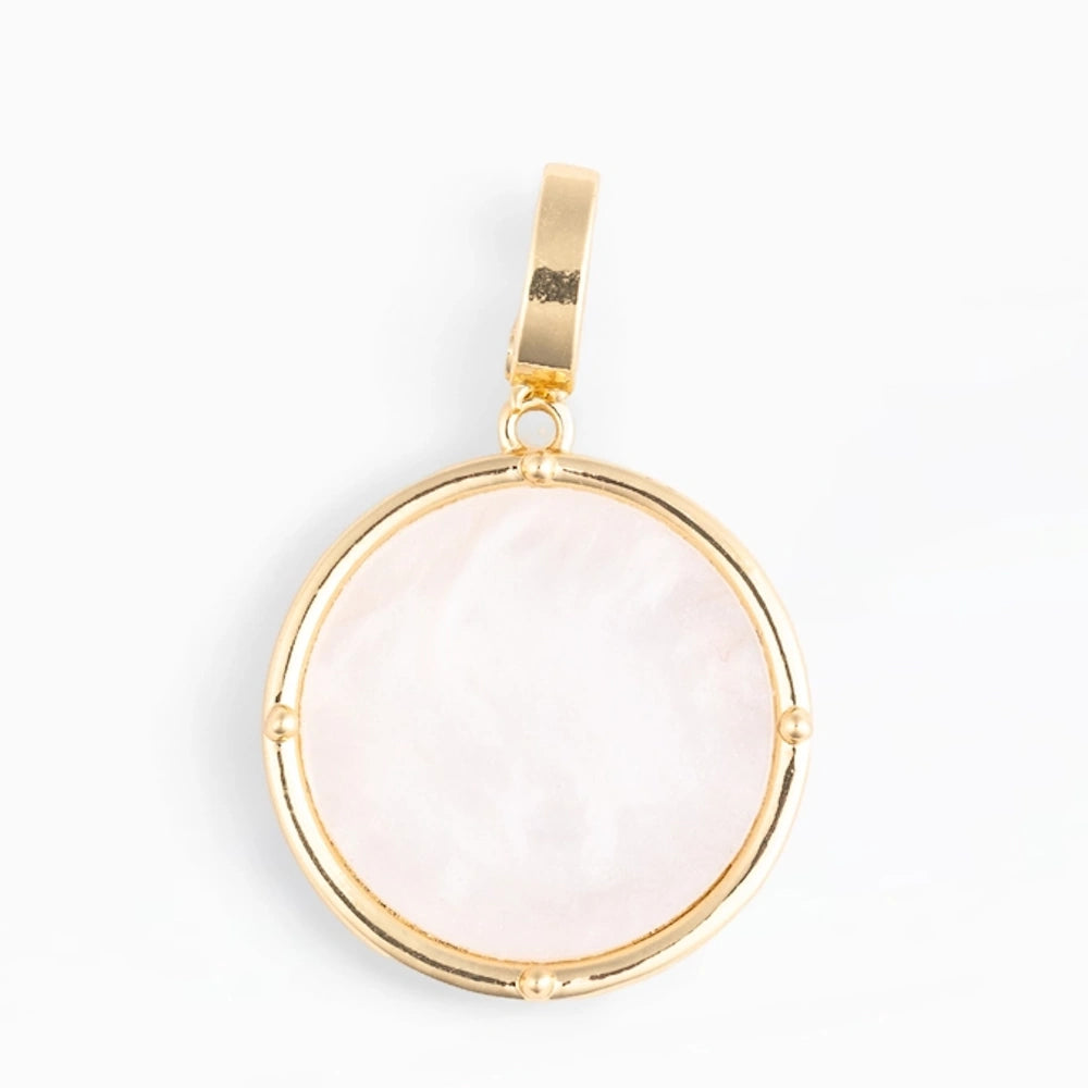 Round mother-of-pearl coin charm pendant in a gold-toned bezel frame.