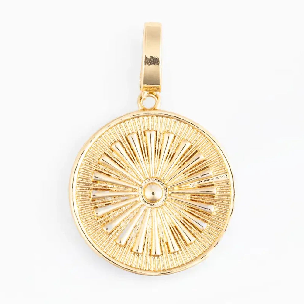Gold round sunburst coin charm pendant on a white background.