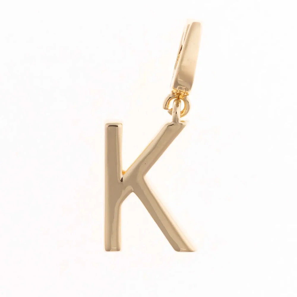 Gold charm pendant shaped in the capital letter "K" with a polished finish and top attachment bail.