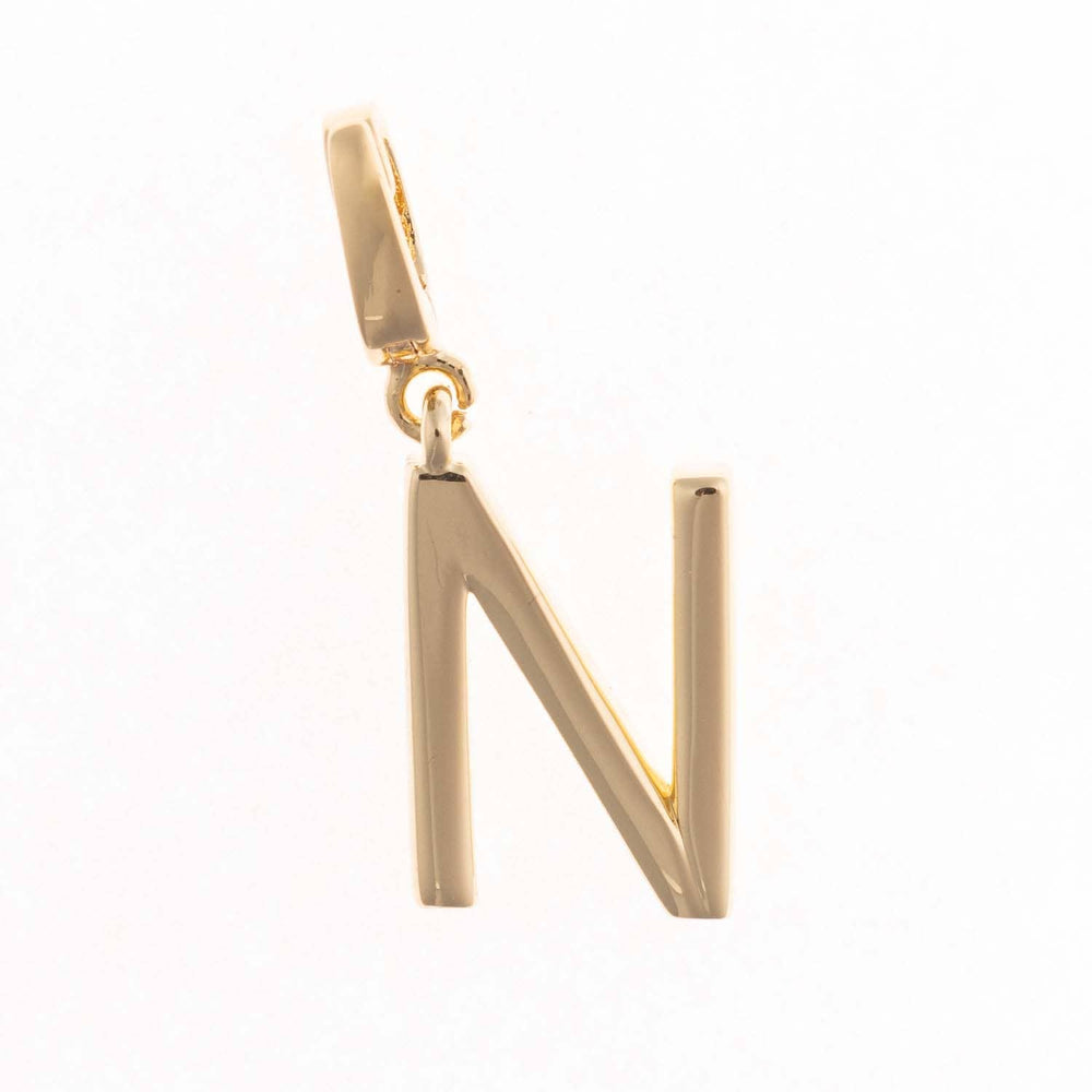 Gold charm pendant shaped in the capital letter "N" with a polished finish and top attachment bail.