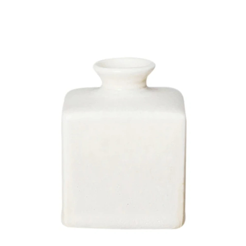 Small white ceramic square vase with rounded edges, a subtle matte finish, and a short flared neck.