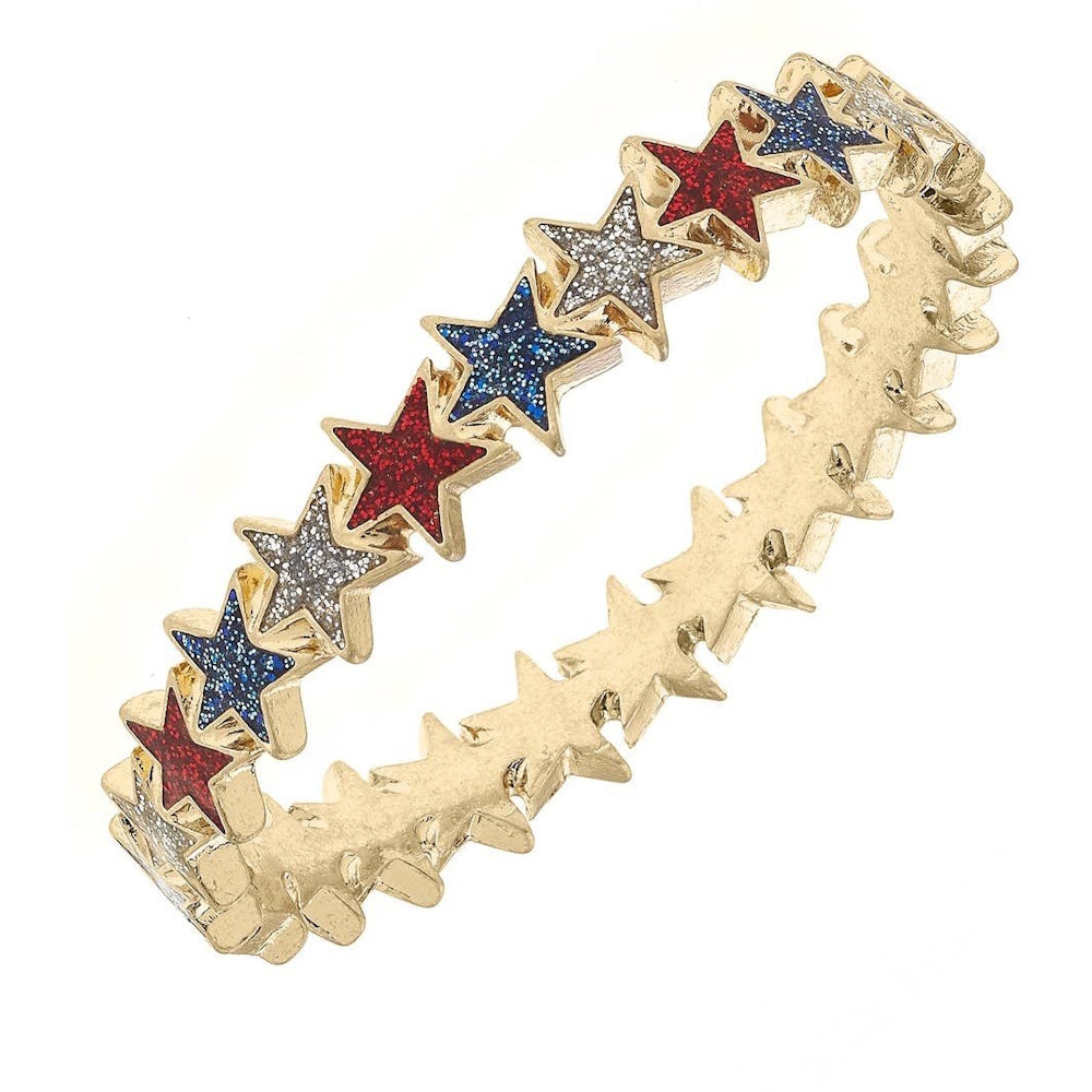 A gold hinge bangle bracelet made of connected stars filled with glittery red, white, and blue colors.