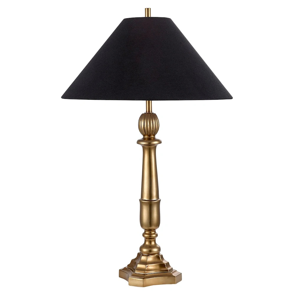 Traditional gold candlestick table lamp with a black tapered fabric shade on a white background.