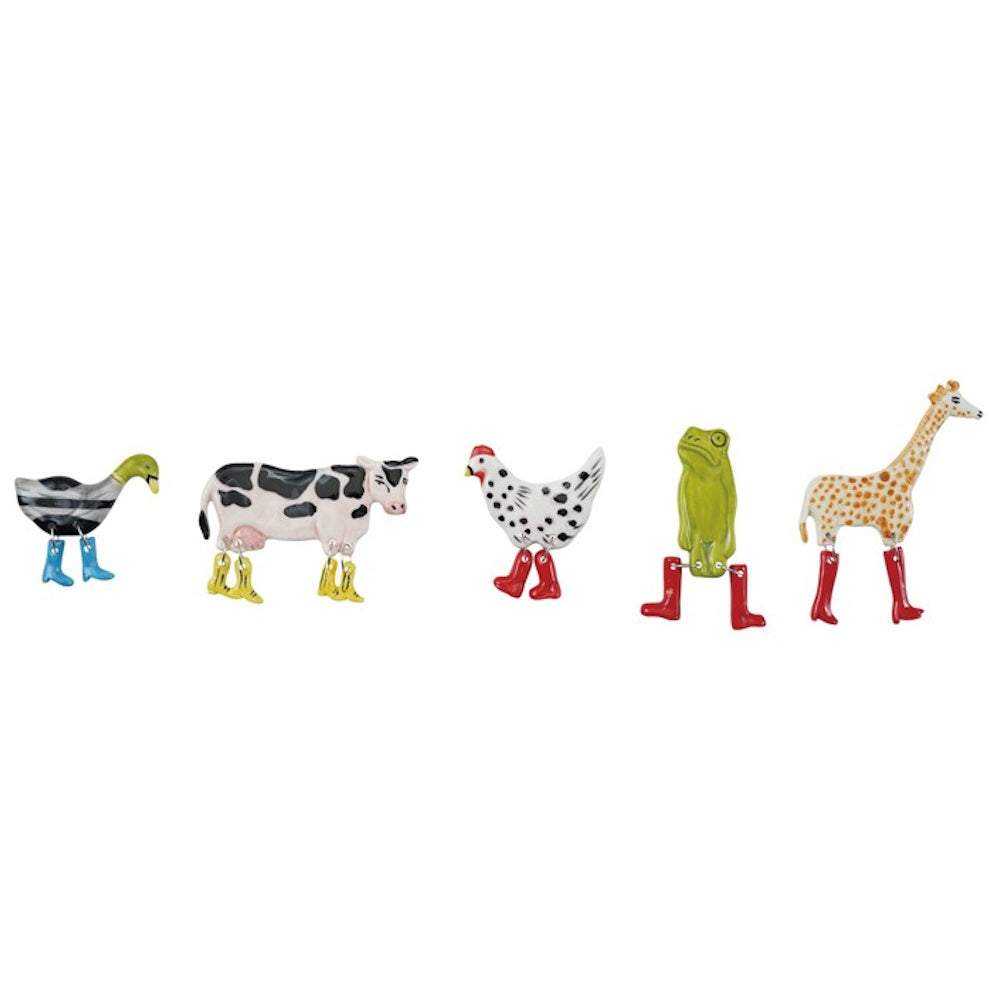 Five stoneware animal magnets (duck, cow, chicken, frog, giraffe) with colorful dangling boots on a white background.