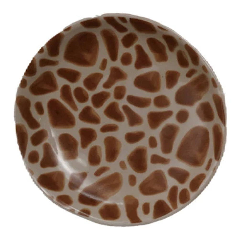 Round ceramic plate with brown and tan giraffe print pattern for animal-themed home decor.