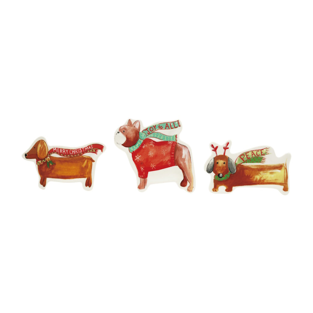 A set of three stoneware Christmas dog dishes featuring festive scarves and holiday greetings.