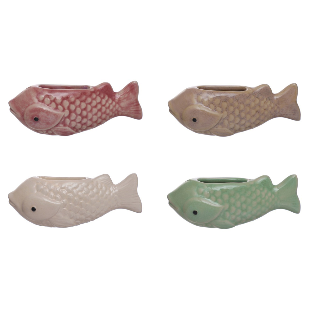 Set of four colorful stoneware fish-shaped mini magnetic vases in pink, tan, cream, and green with scale textures.
