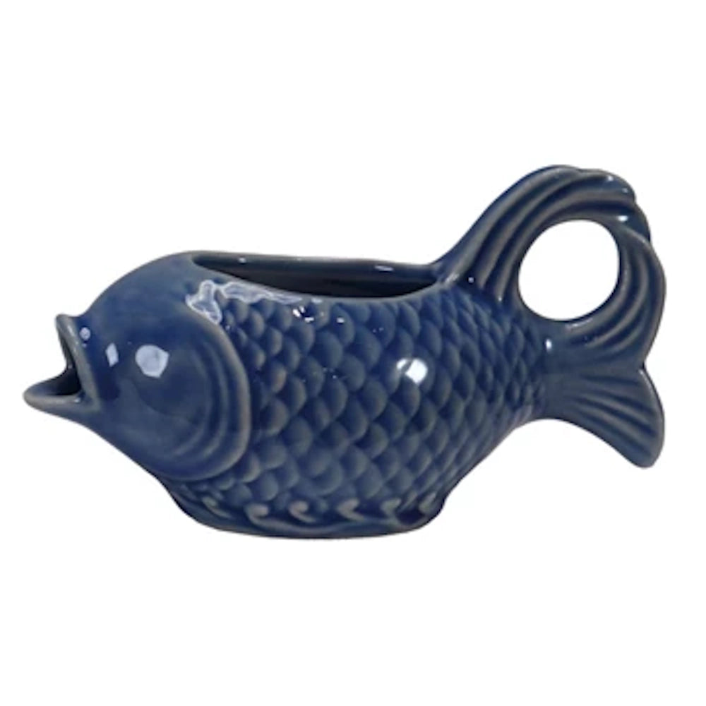 Blue ceramic fish-shaped gravy boat or creamer pitcher with detailed scales and tail handle.