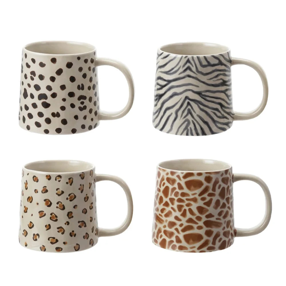 Set of 4 ceramic coffee mugs featuring animal prints: leopard, zebra, cheetah, and giraffe patterns on a white background.