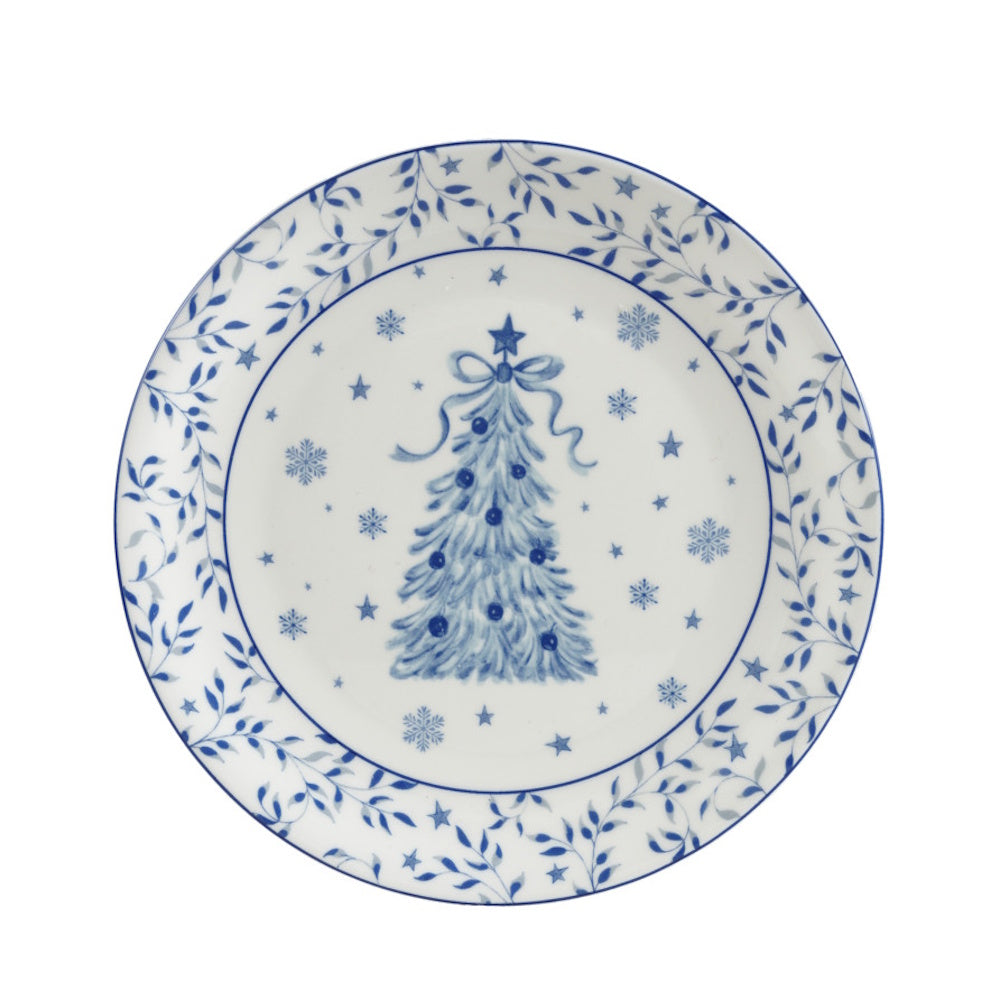 A blue and white stoneware plate featuring a holiday tree pattern with snowflakes and a decorative border.