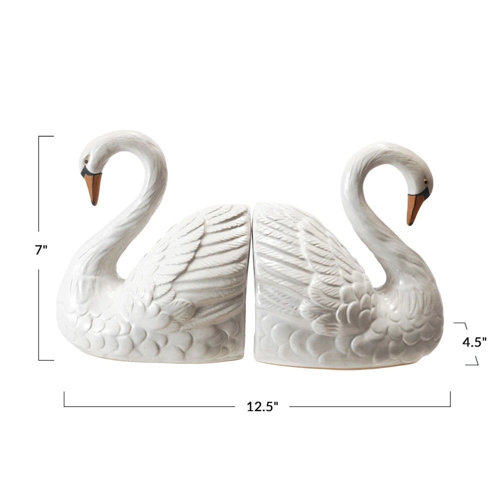 White ceramic swan bookends set with dimensions. Perfect for elegant home office decor and shelf organization.
