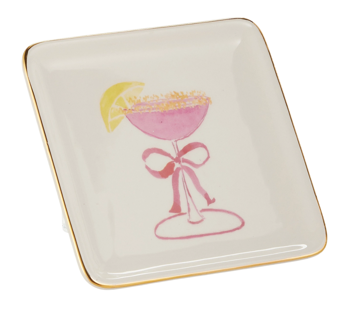 Square white plate with gold trim, featuring a pink cocktail illustration. The drink has a lemon wedge and a pink bow on the stem.