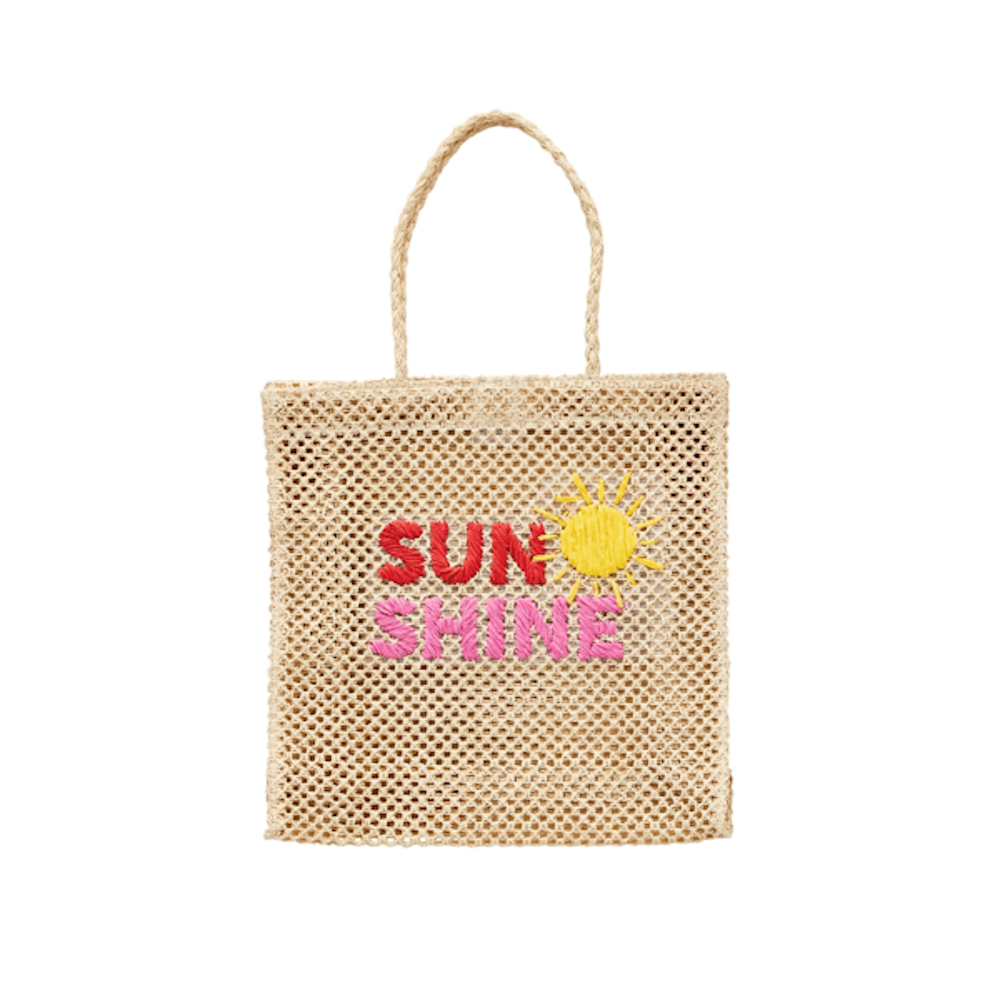 A woven straw tote bag with a single handle, featuring the word "SUNSHINE" embroidered in red and pink with a sun.