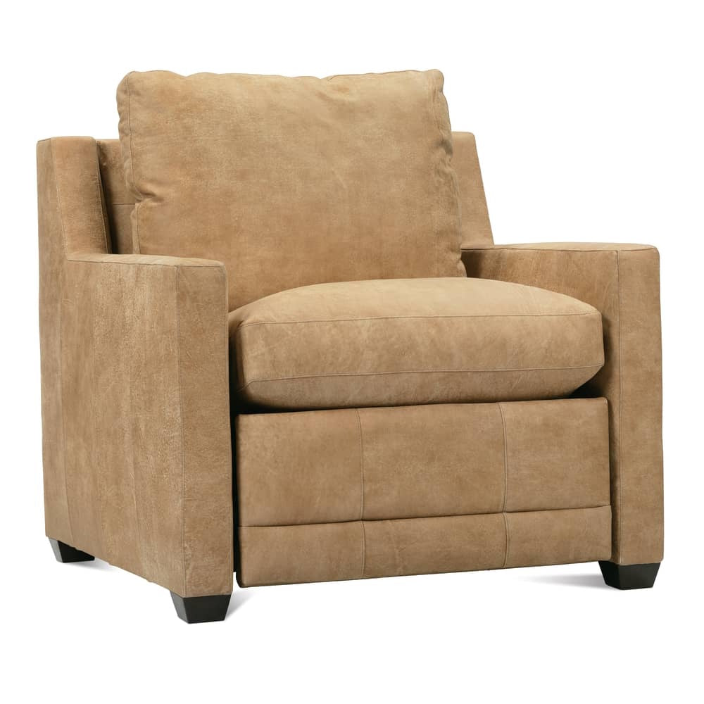 Side angle of a tan leather recliner chair with square arms and plush back cushion for modern home decor.