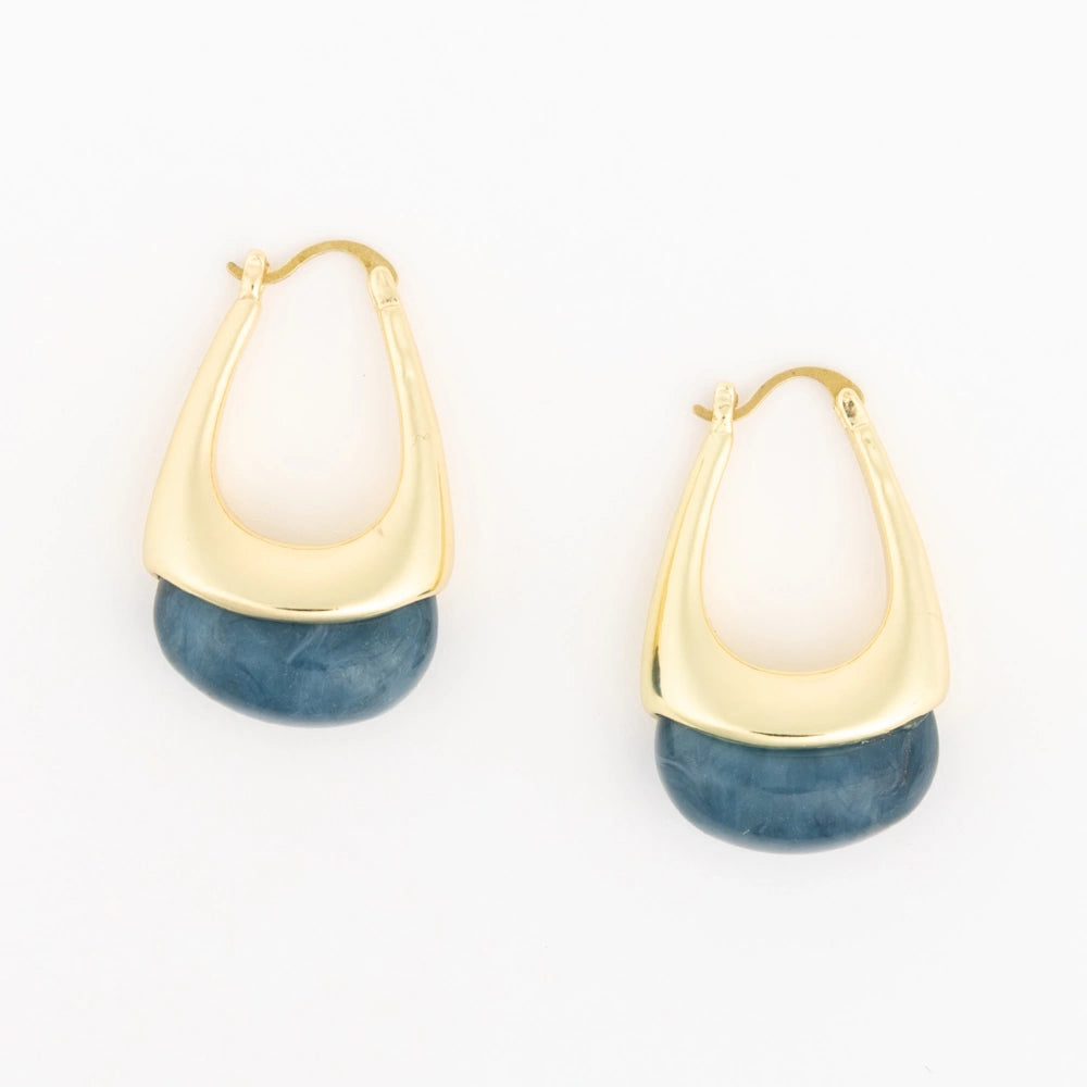 Pair of gold teardrop hoop earrings with teal resin bottoms on a plain white background.