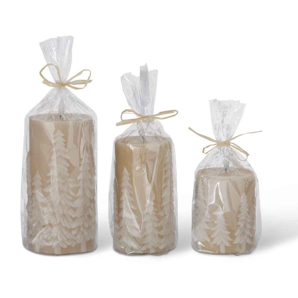 A set of three tan LED pillar candles with embossed tree patterns, individually wrapped in clear plastic bags tied with twine.