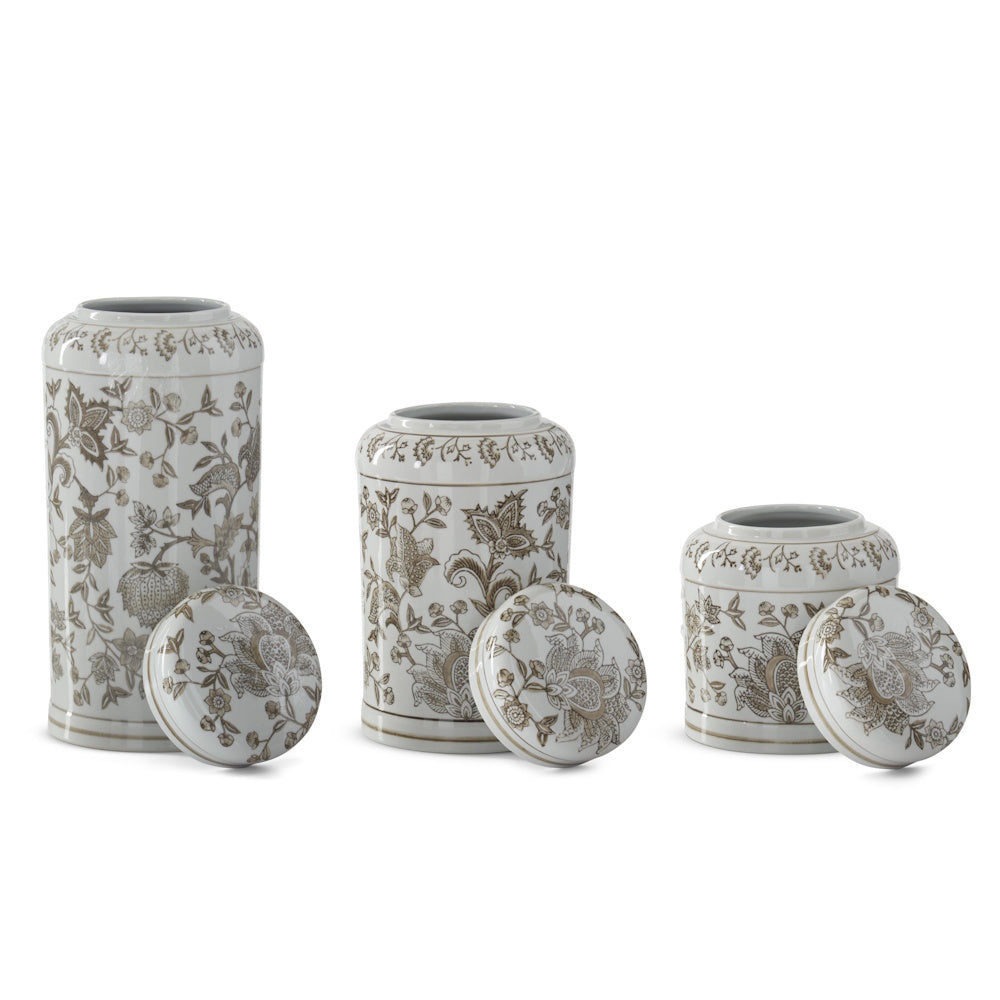 Taupe and white porcelain chinoiserie jars with lids removed, showing floral patterns and various sizes.
