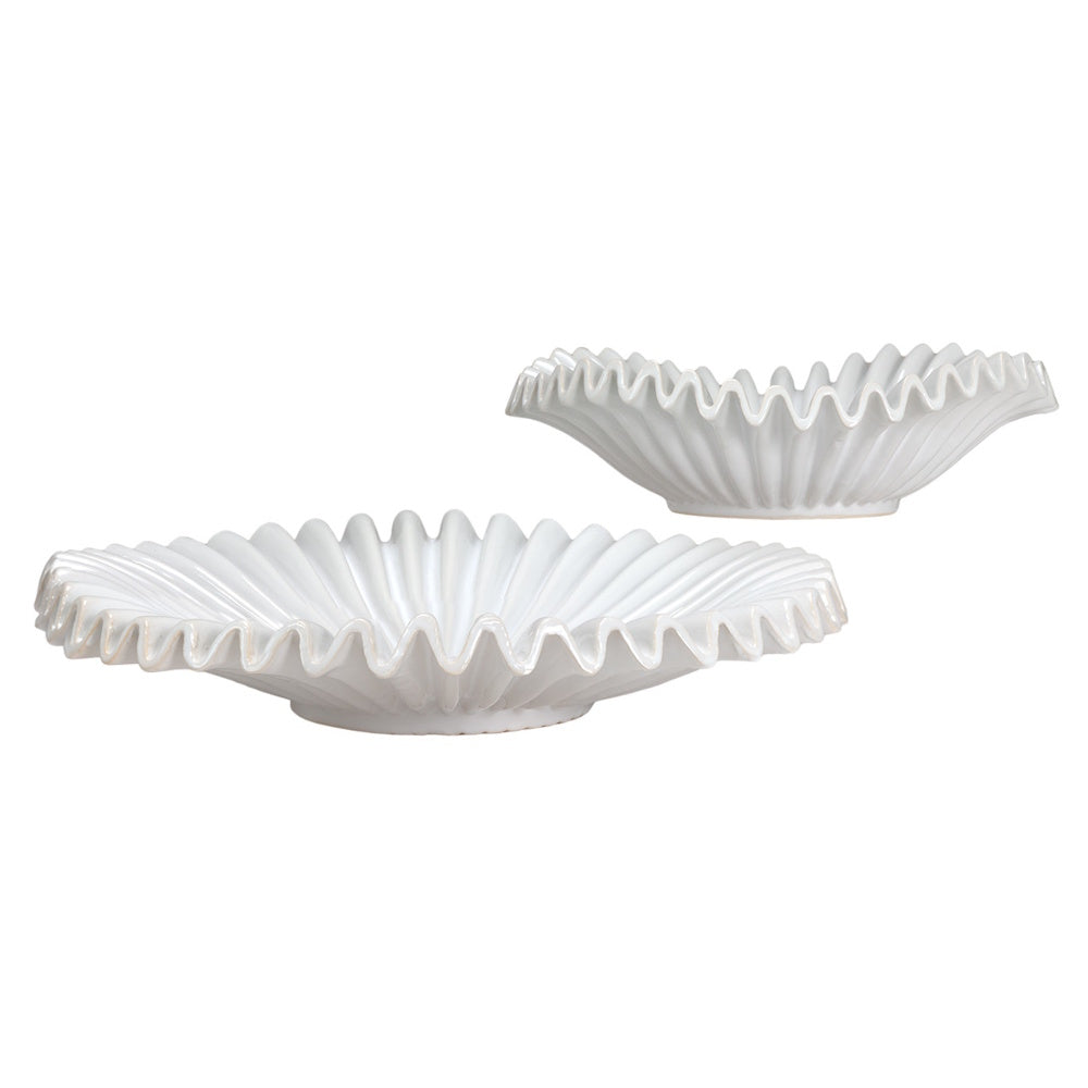 Two white ceramic ruffled bowls with wavy edges and pleated details on a white background.