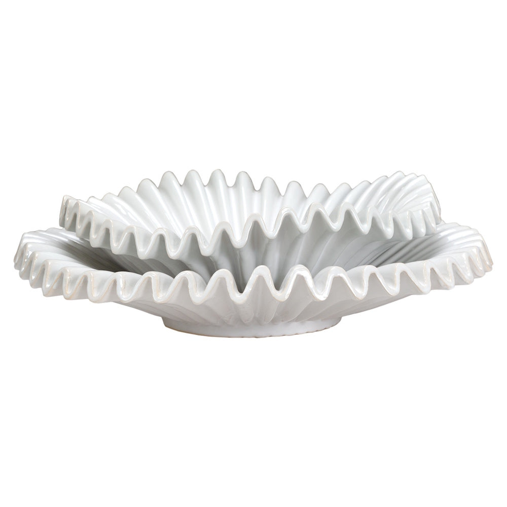Two white ceramic decorative bowls with wavy, ruffled edges stacked on top of each other against a white background.