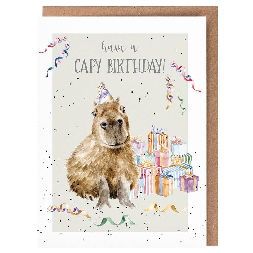 Watercolor capybara wearing a party hat with colorful gifts and streamers. Text reads: "have a CAPY BIRTHDAY!"